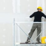 worker plastering gypsum board wall 1024x682